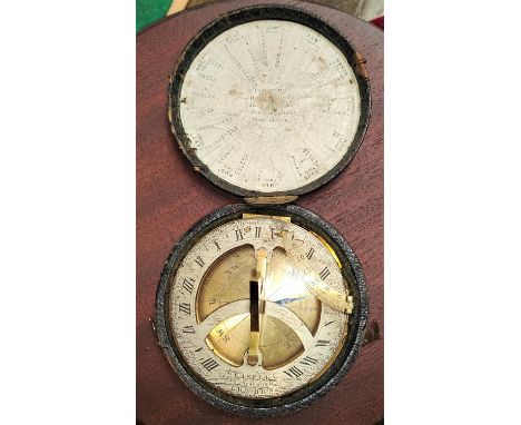 An 18th/19th century pocket sundial with compass in original leather box, by L Cassella 'Maker to the Admiralty', London, lid