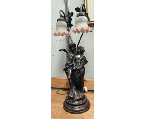 A bronzed table lamp in the form of 2 children, with double swan neck fittings (arm a.f.) 