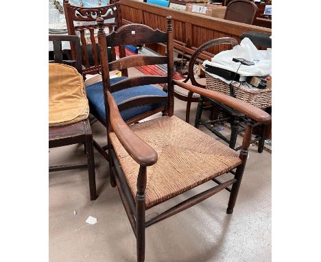 a 19th century beech rush seat ladder back armchair and a Cromwellian style dining chair