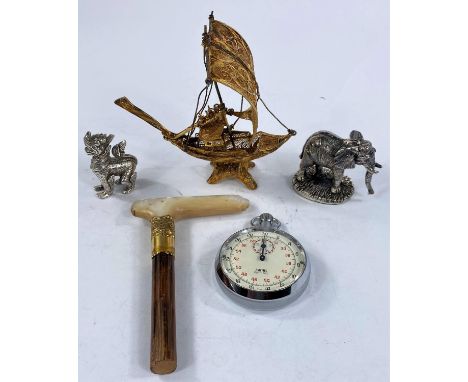 A mother-of-pearl parasol handle with yellow metal collar stamped '18c' (chipped); a gilt metal nef; a Smith's stopwatch; a h