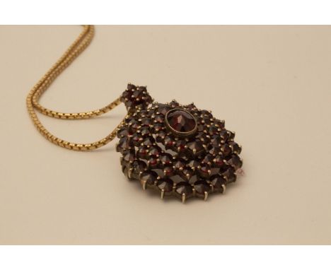 A garnet brooch and chain 