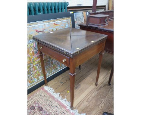 An Early 20th century Mahogany card table. The top with four folding leaves opening to reveal a green baize surface 73cm x 56