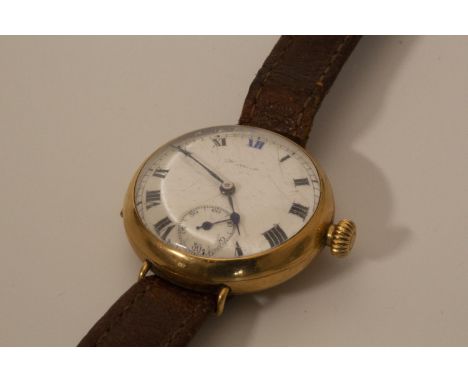 A lady's wrist watch gold colour with enamel dial and Arabic numerals 