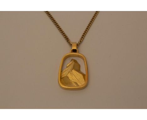A gold pendant and chain 14 grams