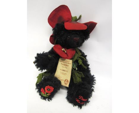 A limited edition Hermann black mohair 'Poppy Bear' teddy bear, with amber coloured plastic eyes, stitched details, felt popp