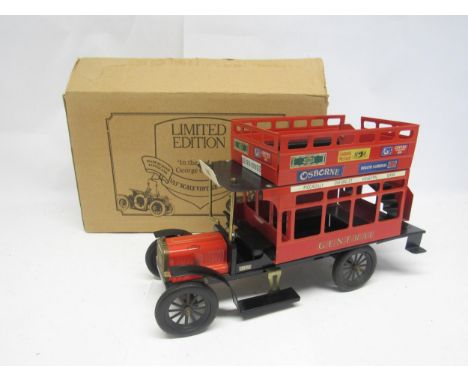 A limited edition 1:13 scale pressed steel model bus in the style of George Carette, 41cm long x 24cm tall, boxed
