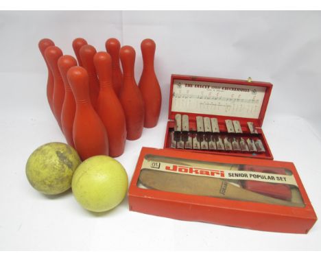 A boxed Jokari bat and ball game, a set of vintage plastic skittles and bowling balls and a toy glockenspiel (3)