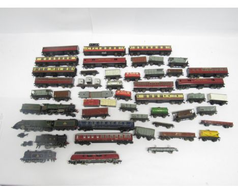 A collection of loose and playworn 00 gauge model railway rolling stock, comprising four Hornby Dublo locomotives to include 