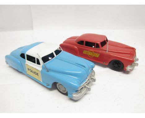 Two vintage Marx plastic friction drive emergency service vehicles to include Police Car and Fire Chief Car (2)