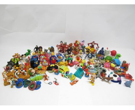 A collection of McDonalds Happy Meal Toys and similar, including Disney Characters, Furbys, Toy Story, Space Jam, Action Man,