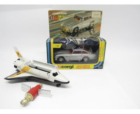 A Corgi diecast 271 James Bond Aston Martin DB5 (1:36 scale) in silver with red interior, with James Bond figure and one band