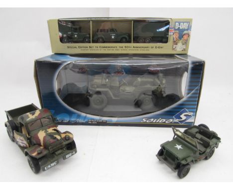 A group of military related diecast model vehicles to include boxed Solido 1:18 scale US Army Willy's Jeep 1942 and Lledo Day