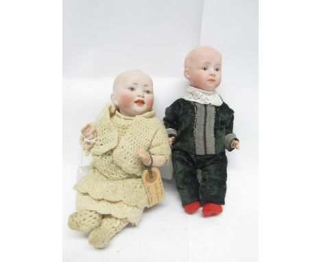 An early 20th Century Gebruder Heubach bisque head boy doll with Intaglio eyes, closed mouth, moulded hair and painted featur