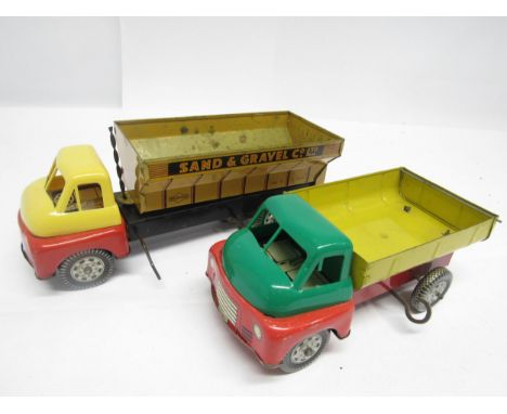 Two playworn Wells Brimtoy tinplate and plastic clockwork Bedford tipper trucks, one in 'Sand &amp; Gravel Co Ltd' livery (2,
