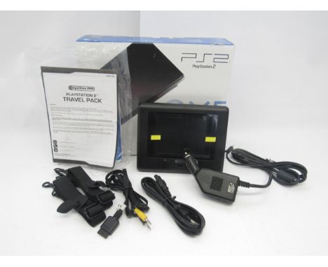 A Competition Pro PlayStation PS2 Travel Pack, comprising car adaptor, game screen and cables, housed in a PS2 console box