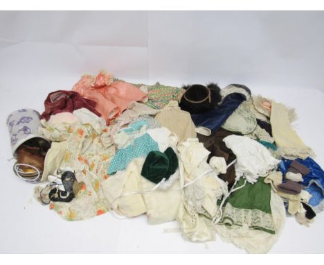 A collection of vintage dolls clothing and accessories including dresses, hats, coats, undergarments, socks, shoes, wigs etc