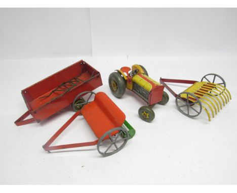 A playworn Mettoy tinplate farm set comprising yellow clockwork tractor and three implements to include mowing machine, trail