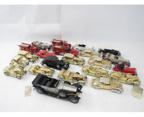 An unboxed Franklin Mint 1:24 scale diecast model 1925 Rolls Royce Silver Ghost, together with a collection of predominantly 