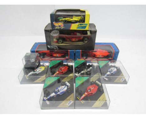Three boxed Hot Wheels Racing 1:24 scale Ferrari Formula One racing cars to include #'s 26687 (x2) and 50287, a perspex cased