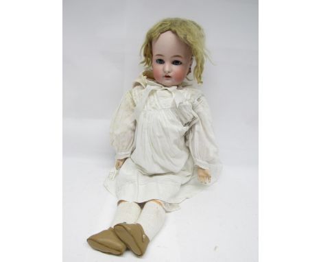 An early 20th Century Simon and Halbig for Kammer and Reinhardt and bisque head girl doll with blonde wig, striated blue glas