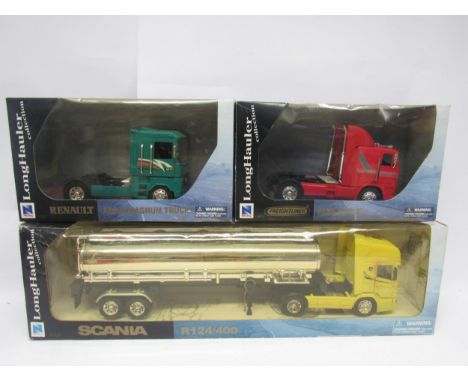 Three boxed New Ray Long Hauler Collection 1:32 scale diecast model heavy haulage vehicles to include 52853 Freightliner FLB 