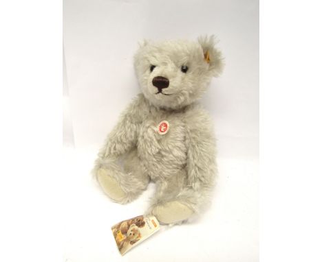 A Steiff white mohair Classic Bear teddy bear #004995, with amber coloured plastic eyes, brown stitched nose and mouth, growl
