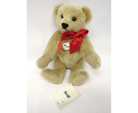 A Steiff pale blonde mohair 'Original Teddy Bear 1909' teddy bear #000379, with black plastic boot button eyes, stitched nose