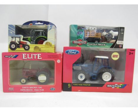 Two boxed Britains farm issue diecast tractors to include 04180 David Brown 990 Implematic Tractor (box faded) and 43011 Ford