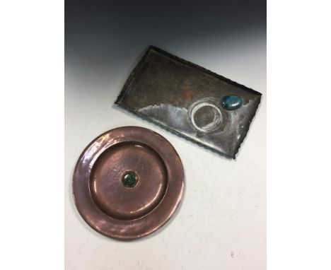 Two Arts & Crafts enamelled copper trays, the first of circular form with central Ruskin type enamel cabochon, the other of r