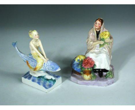 A Royal Worcester model of the 'Dublin Flower Girl' by Anne Acheson, model no. 2921, painted and printed marks, together with