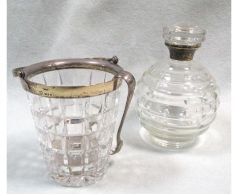 A silver mounted ice bucket by the Goldsmiths & Silversmiths Company, London 1937, the square cut glass bucket shape base wit