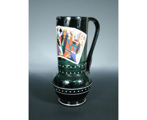 Attributed to Fritz Heckert of Petersdorf, a Historismus enamelled glass jug, the green glass body decorated with playing car