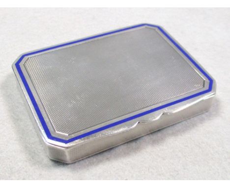 An Art Deco silver and enamel cigarette case, London, 1932, the engine turned case with blue enamel stringing to sprung hinge