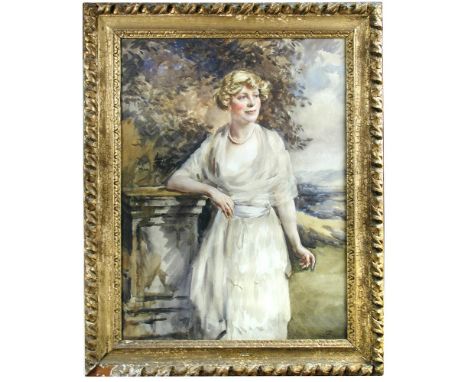 English School , early 20th Century  Portrait of a lady in a cream voile dress by a pedestal in a garden signed lower right w