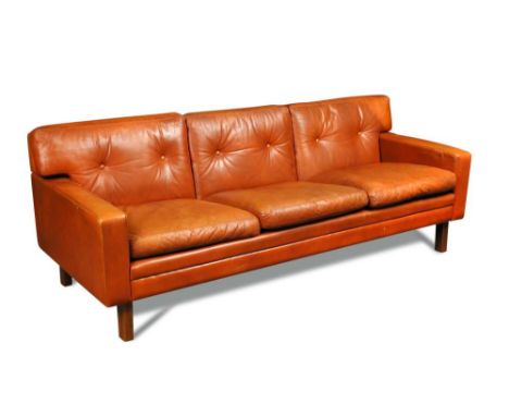 A 1960's Danish cognac leather three-seat sofa, raised on beech legs 68 x 188 x 73cm (27 x 73 x 28in)  