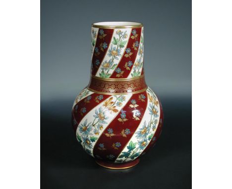 A large Sarreguemines floral painted vase, circa 1880 the baluster form painted and gilded with twisted bands of floral decor