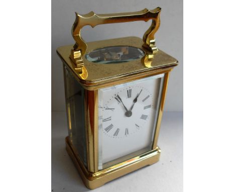 A French carriage clock in original carrycase, the movement back plate signed R & Co., Made in Paris within a corniche brass 