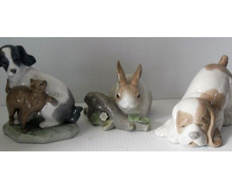 A Lladro rabbit and two NAO figures, one of a puppy and another with a cat (3). One petal chipped from one flower on rabbit f