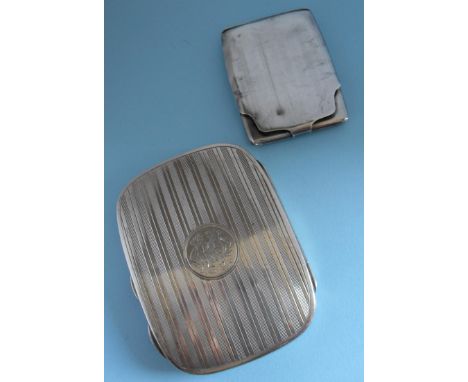 A George V silver cigarette case with rounded corners, engine turned decoration, inscribed medallion cartouche to centre and 