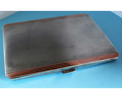 An Edward VIII silver cigarette case with engine turned design and gilded fluted edges, inscription to inside by Northern Gol