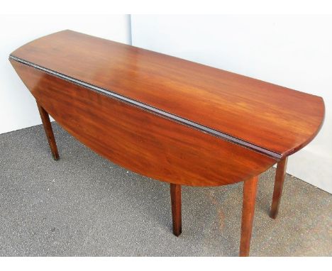 A Georgian Cuban mahogany hunt table with twin drop leaves, gate-leg action on square tapering legs, probably Irish, 73 x 163