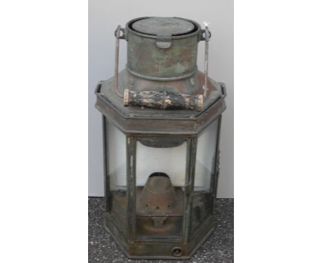 A 19th century copper carriage lamp with swing handle, fitted for hanging 