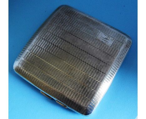 A George VI silver cigarette case with engine turned design by W. H. Tandy & Sons, Chester, 1940, 3.2 oz and a Sheffield silv
