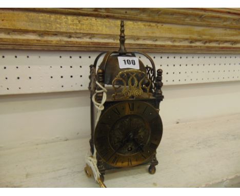 A brass lantern clock