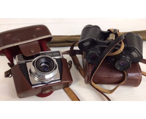 A 1960's Zeiss cased camera, with a 1960's pair of binoculars, plus a mid 20th Century fishing rod