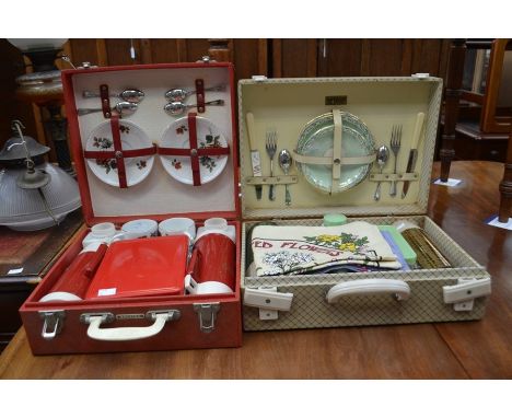 A vintage Brexton four piece picnic set to include four cups and saucers decorated with red roses, steel spoons, two thermos 