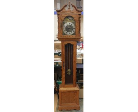 An Emperor oak longcase clock, late 20th Century, having a triple weighted movement