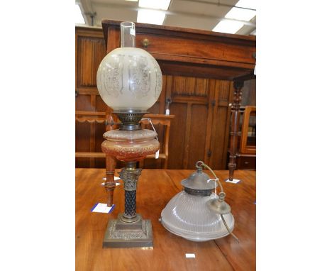 A Victorian oil lamp with brass Corinthian column base stand, glass resevoir beneath bulbous etched shade, internal shade etc