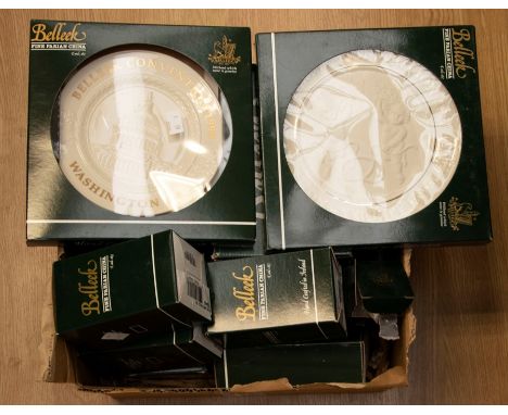 A collection of Belleek boxed china items including plates, small bells, miniature bags etc