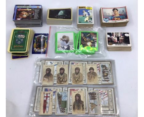 A collection of assorted vintage and modern trading cards, to include: Star Wars, Batman; Merlin and many others, a good sort